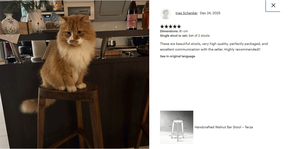 Cat sitting on a wooden stool with a product description on the right side.